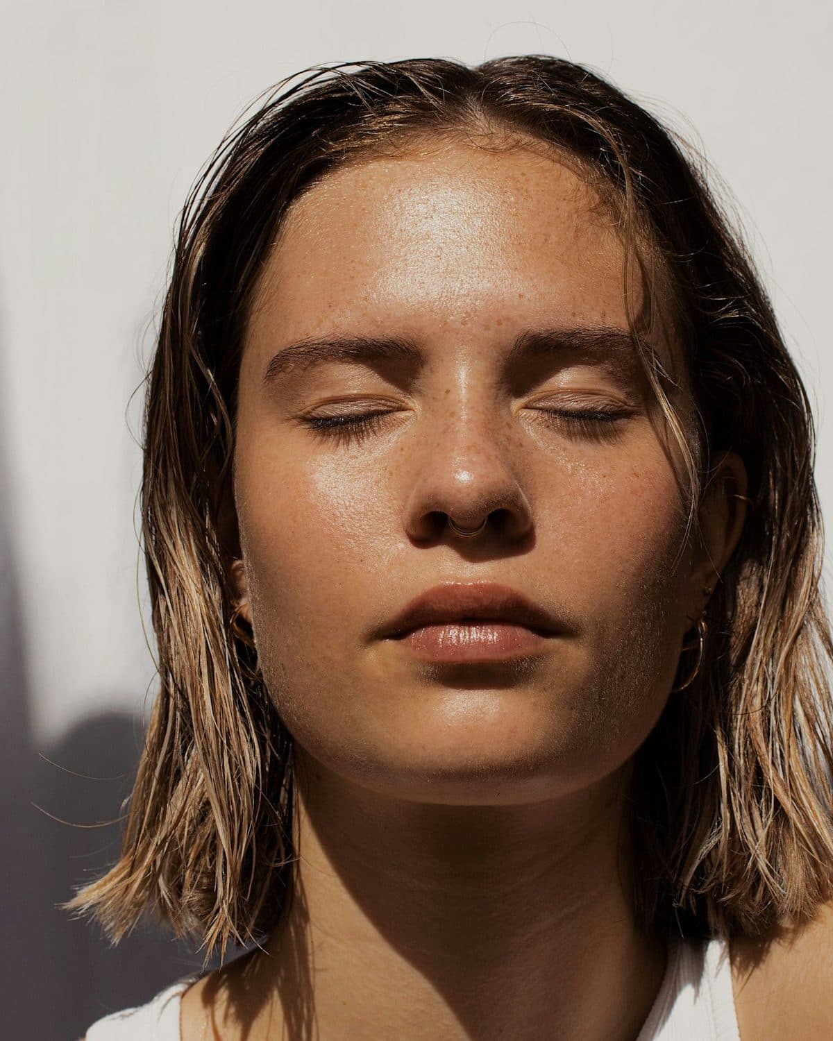 Bare skin in daylight, texture and freckles left alone