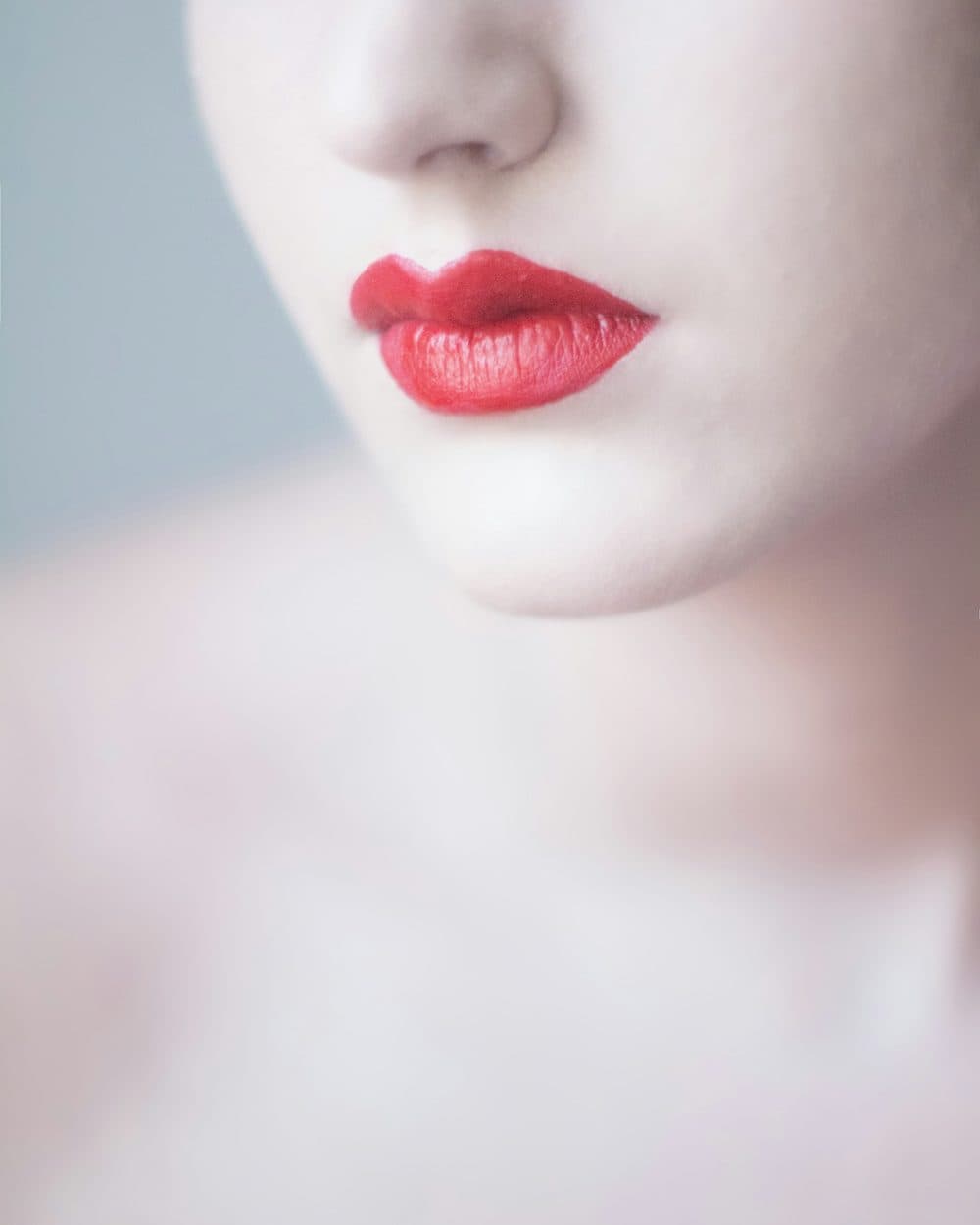 A true red worn on bare skin in soft daylight